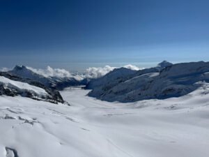 A view from Jungfraujoch, the Top of Europe, looking out over the Aletsch Glacier stretching through the Swiss Alps.