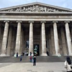 Front entrance of the British Museum with its enormous Greek‑style columns and grand stone façade.
