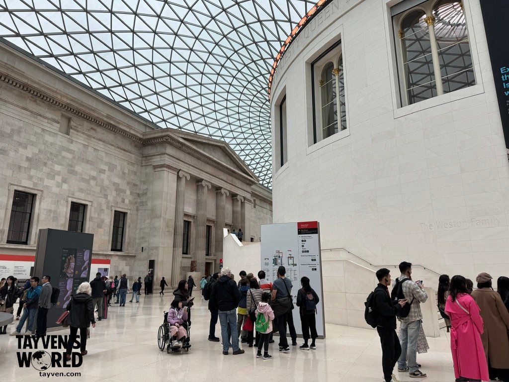 British Museum Great Court Interior of the British Museum’s Great Court with its glass roof, Reading Room, and visitors exploring the space.