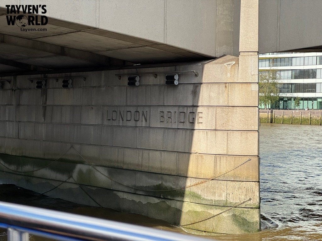 Close‑up of the “London Bridge” engraving on the stone side of the bridge above the Thames.