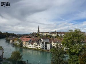 Panoramic view of Bern’s old town and river under a partly cloudy sky