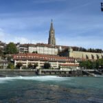 Riverside view of Bern with cathedral tower and historic buildings
