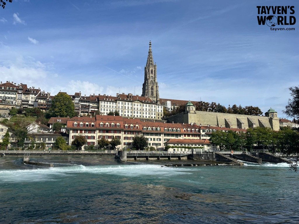 Riverside view of Bern with cathedral tower and historic buildings