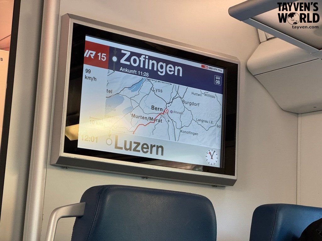 Train information screen showing route from Bern to Lucerne with map, speed, and arrival time.