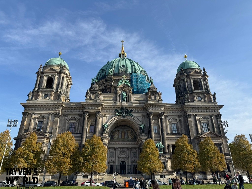 Front exterior of Berlin Cathedral with green dome and twin towers in central Berlin