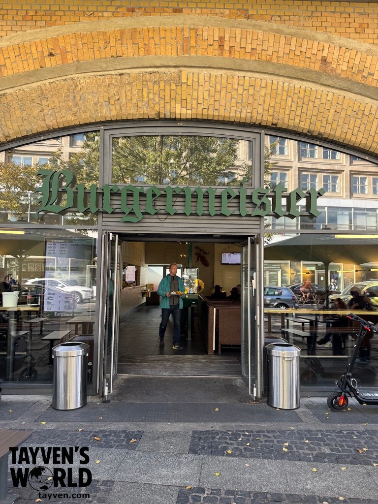 Entrance to Burgermeister beneath a brick railway arch in Berlin